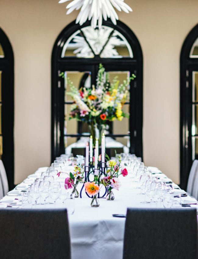 A set table for a dinner in the Ariana Room in luxury boutique hotel The Dylan Amsterdam, member of the leading hotels of the world.