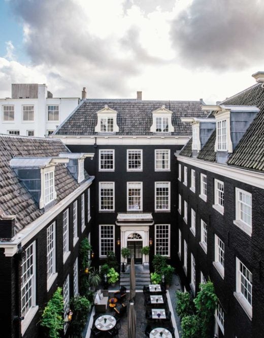 A view from one of the rooms in luxury boutique hotel The Dylan Amsterdam, member of the leading hotels of the world. View on the building and the secluded garden.