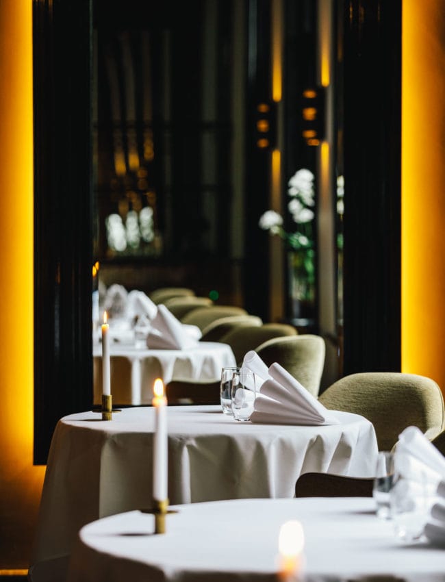 A table in 2 michelin star restaurant Vinkeles, in luxury boutique hotel The Dylan Amsterdam.