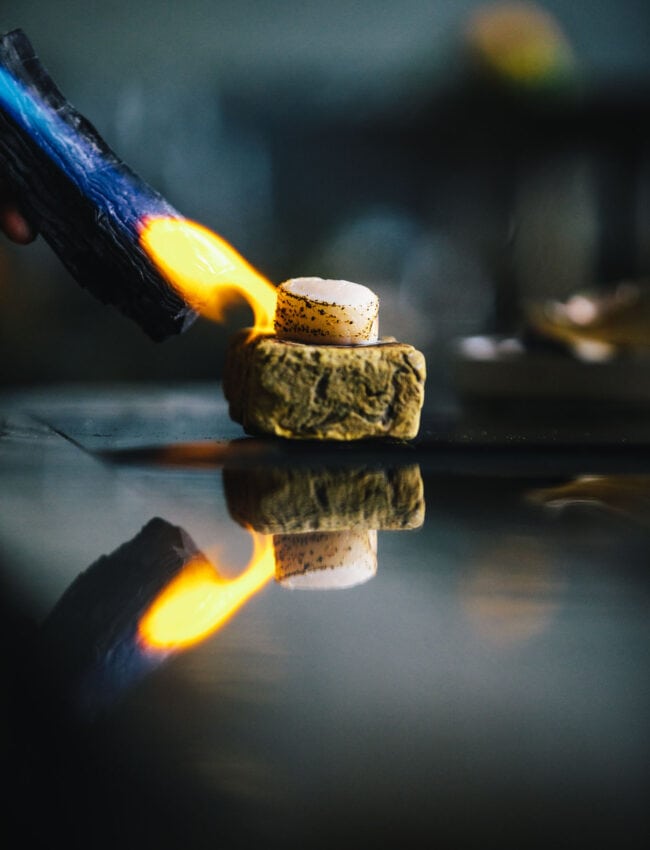 This is the scallop before it is sliced. It is flamed on a stone. The scallop is a dish at restaurant até in luxury boutique hotel, The Dylan Amsterdam, member of the leading hotels of the world.
