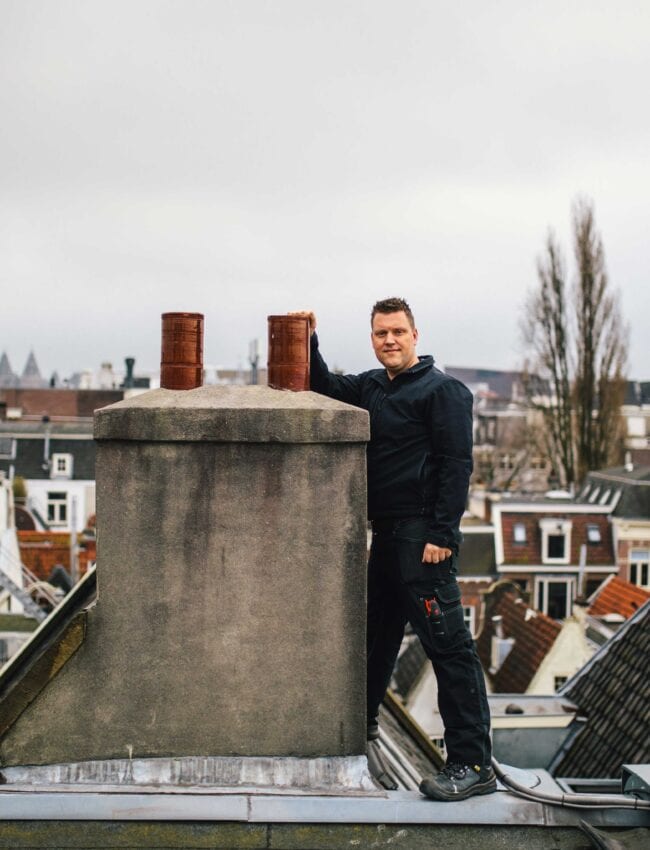 Chief engineer, luxury boutique hotel Amsterdam, The Dylan, Posing next to the chimney on the roof.