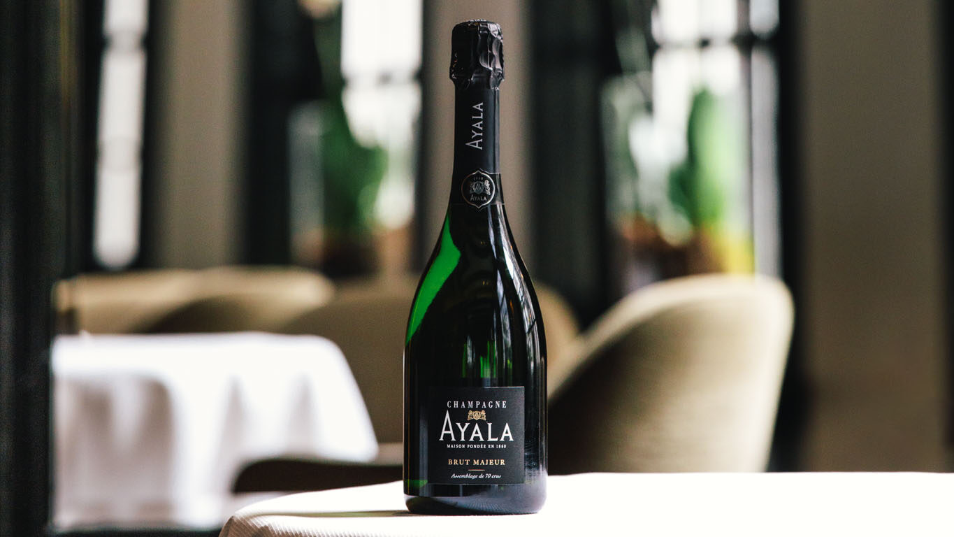 A bottle of Champagne presented in Restaurant Vinkeles, with 2 Michelin stars in luxury boutique hotel The Dylan in Amsterdam, a member of The Leading Hotels of The World.